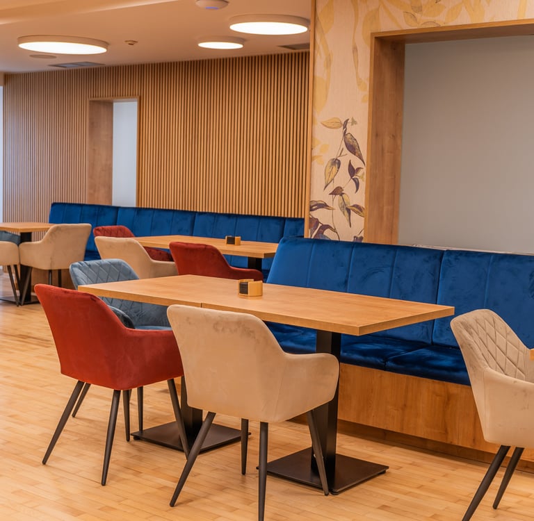 a restaurant with a long table and chairs