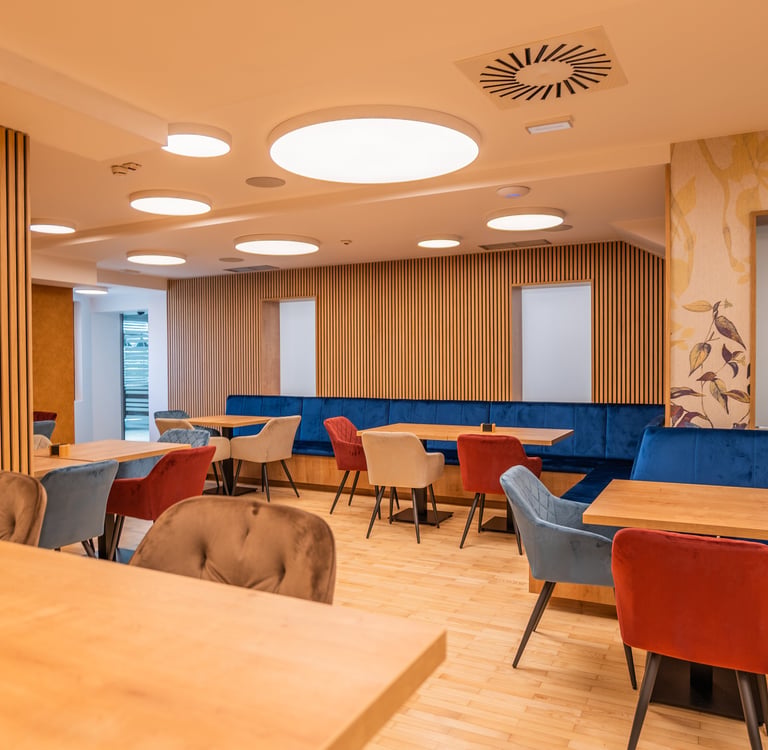 a restaurant with a wooden table and chairs