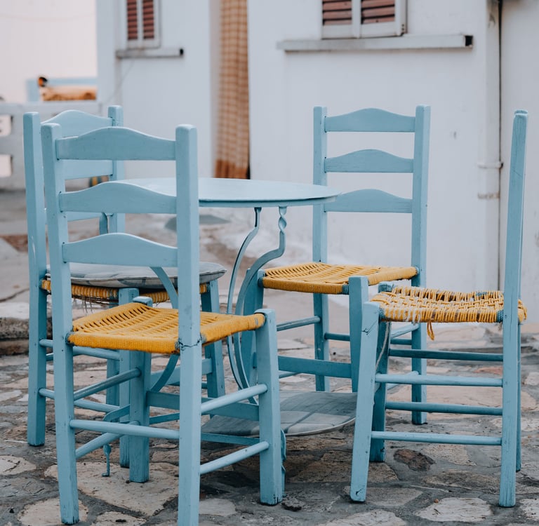 a table with chairs and chairs and a dog