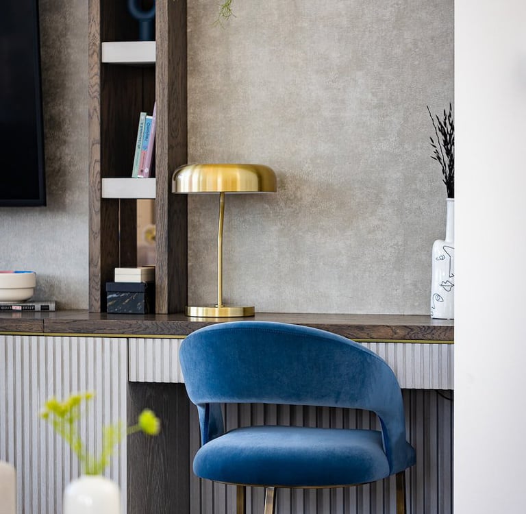 a blue chair with a blue chair and a tv