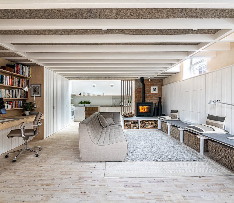 a living room with a couch and a desk