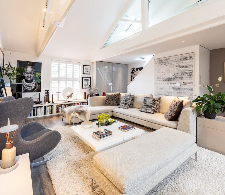 a living room with a couch and a fireplace