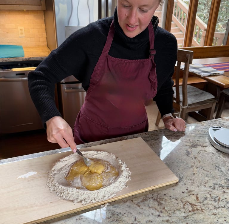 Class participant making pasta dough