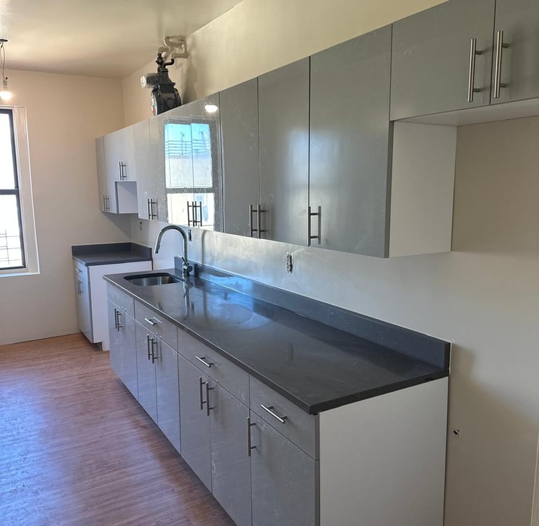 a kitchen with a counter top and cabinets