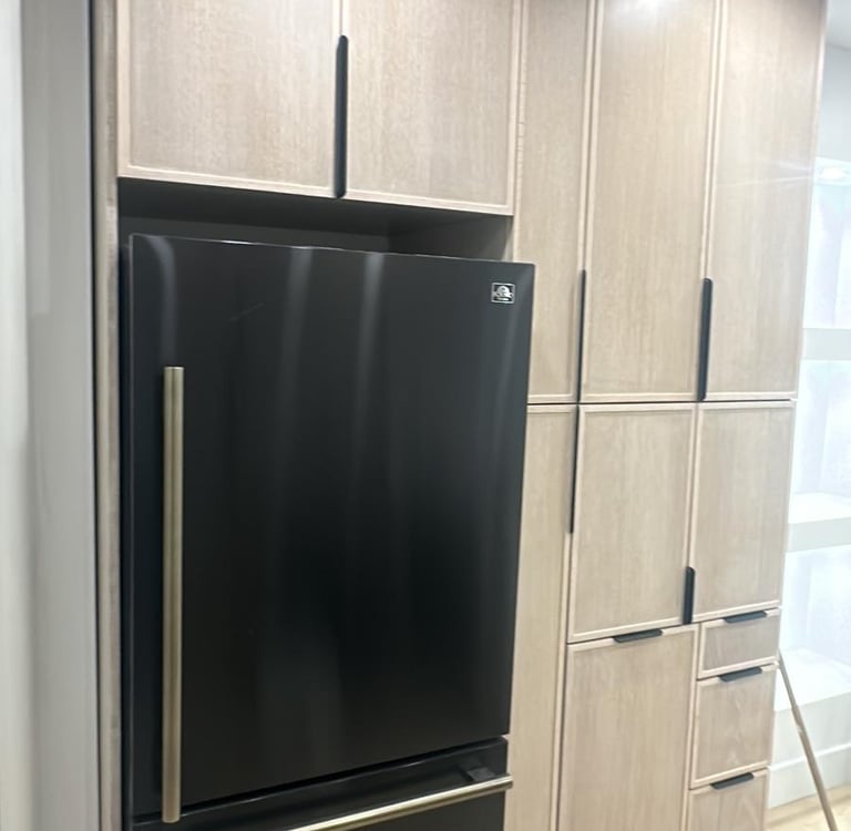 a refrigerator with a black refrigerator and a black refrigerator