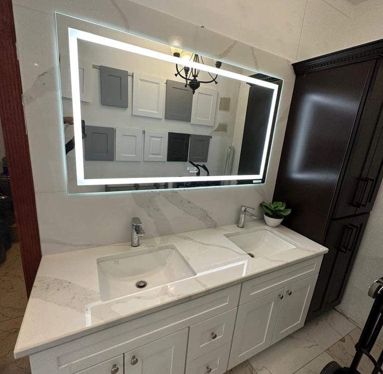 a bathroom with a large mirror and a chandelier