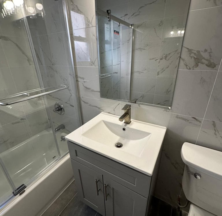 a bathroom with a sink and a shower