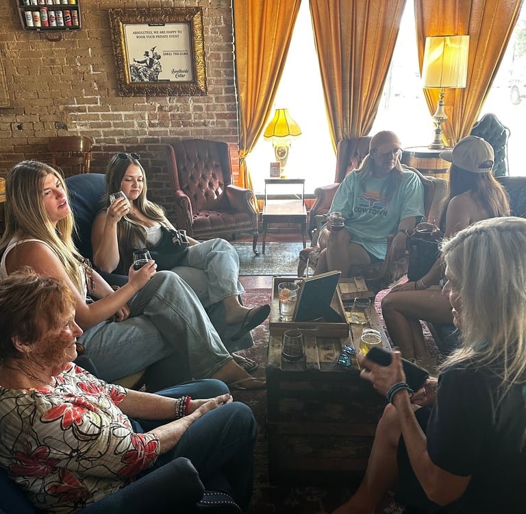Fort Worth girls weekend ladies in a rustic lounge with brick walls, velvet chairs, and drinks.