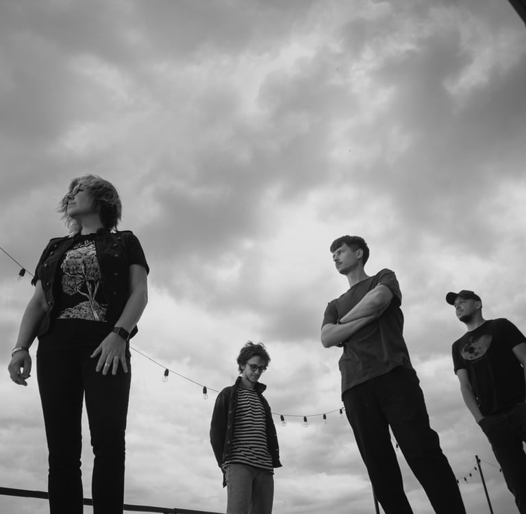 a group of people standing on a skateboard