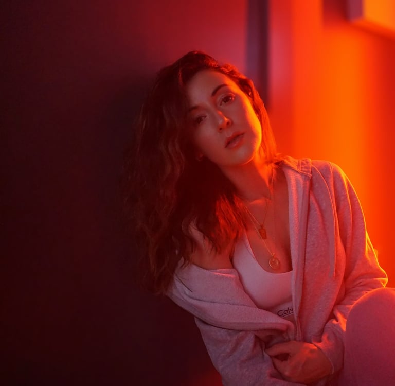 a woman sitting on a bench in a room