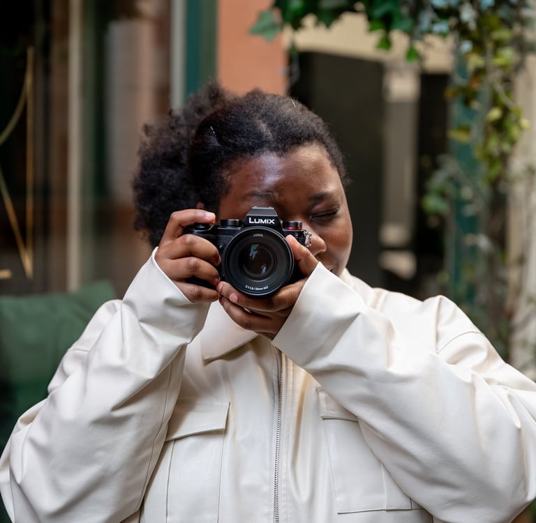 a black woman taking a self portrait of herself