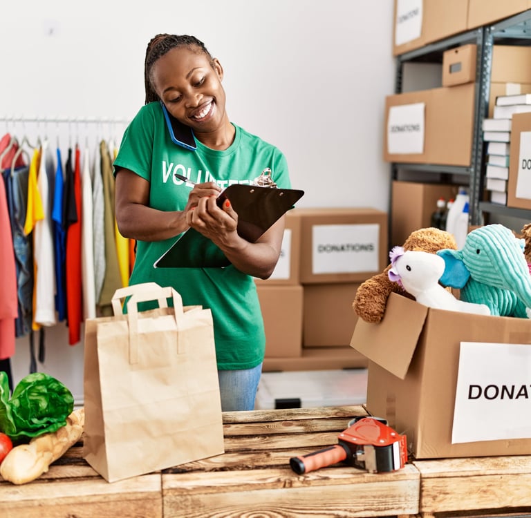 African American Woman Volunteering at donation station