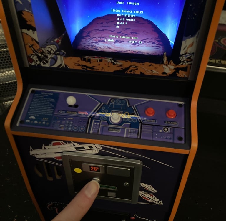 Numskull Space Invaders Inserting a Coin