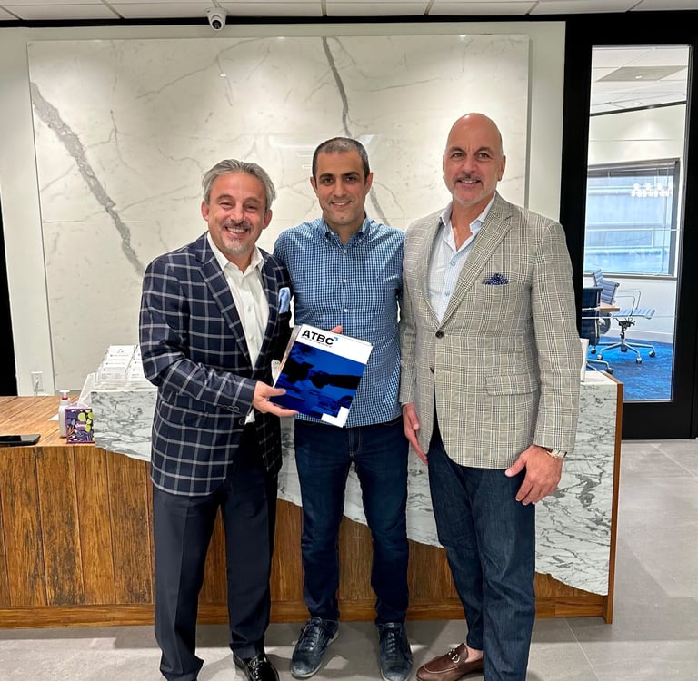 a man in a suit and tie is holding a plaque