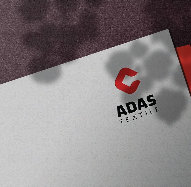 a close up of a business card with a red and white background