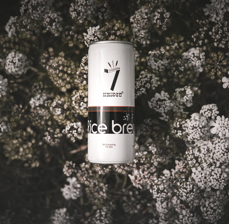 7 united rice beer in an Aluminium can with a floral backdrop