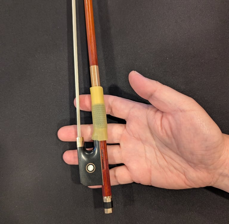 place the bow in the right hand