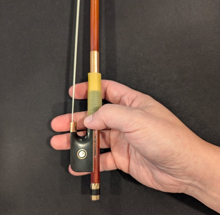 Curled thumb on the stick