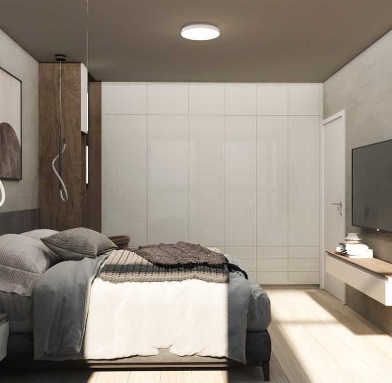 A contemporary bedroom featuring a bed, a television, and a desk, showcasing a stylish,functional