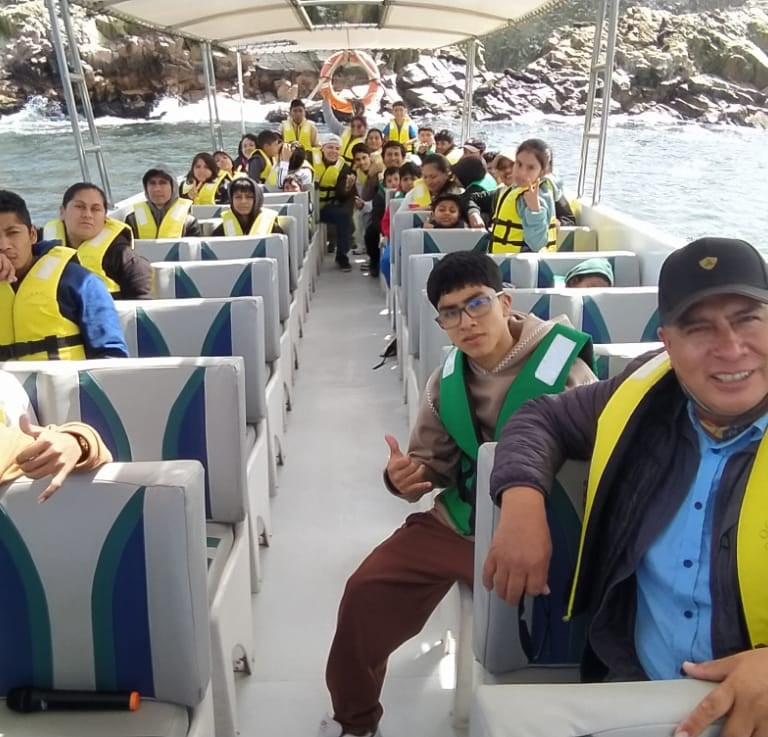 a group of people on a boat in the water