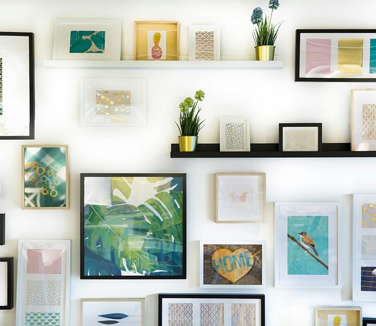 Various picture frames hanging on a wall