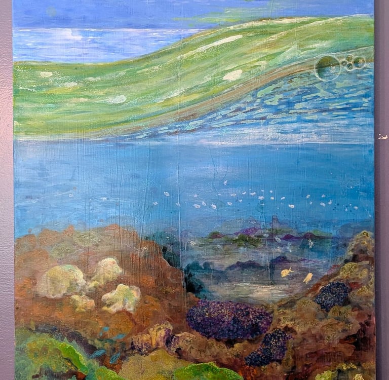 A color rich acrylic painting of coral reef life under a cloudy bright sky and saltwater waves by Kathy LaFollett.