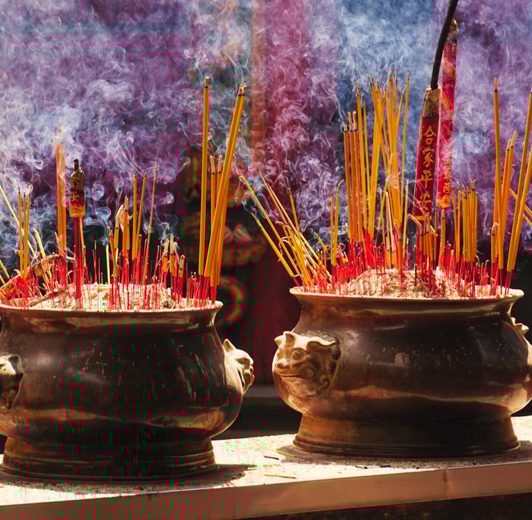 Incense burning in a Vietnamese temple with rising smoke