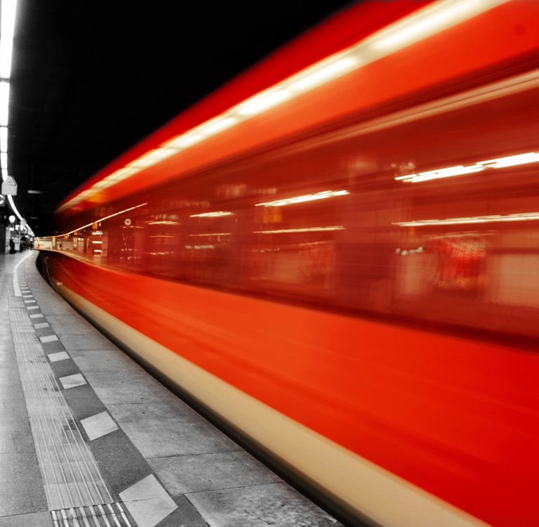a train is moving along the tracks in a subway