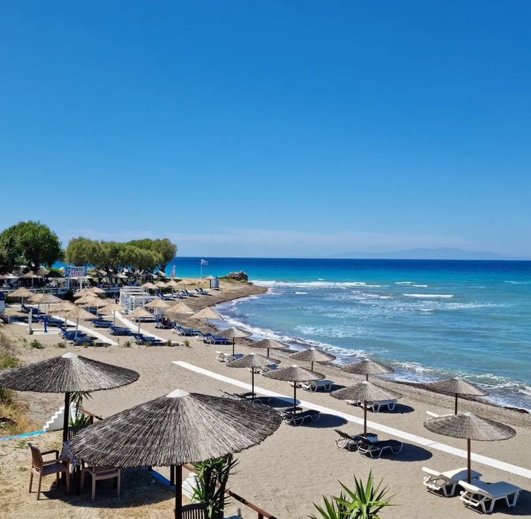 a beach with umbrellas and umbrellas on the beach