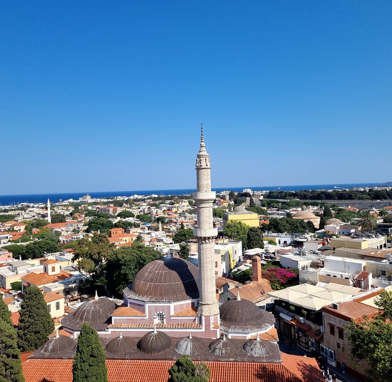 Panoramic aerial view of the Sulemaniye Mosque and old town architecture in Rhodes, Greece.