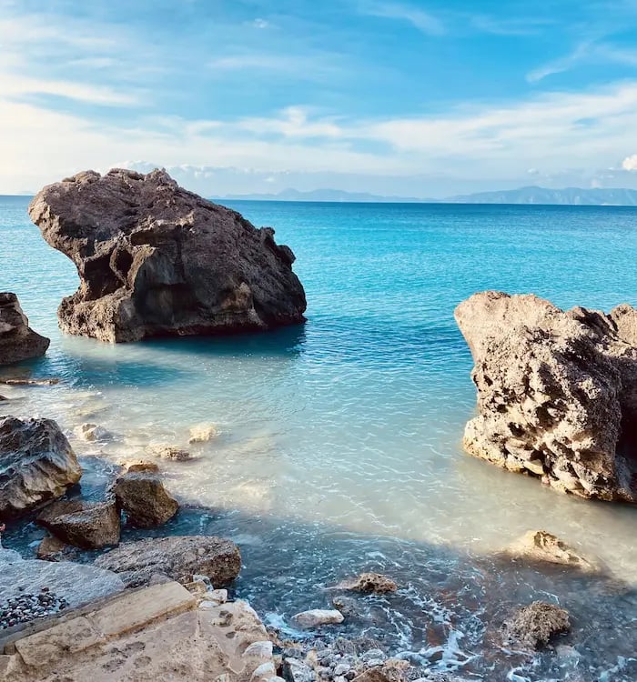  a rocky beach near a body of water