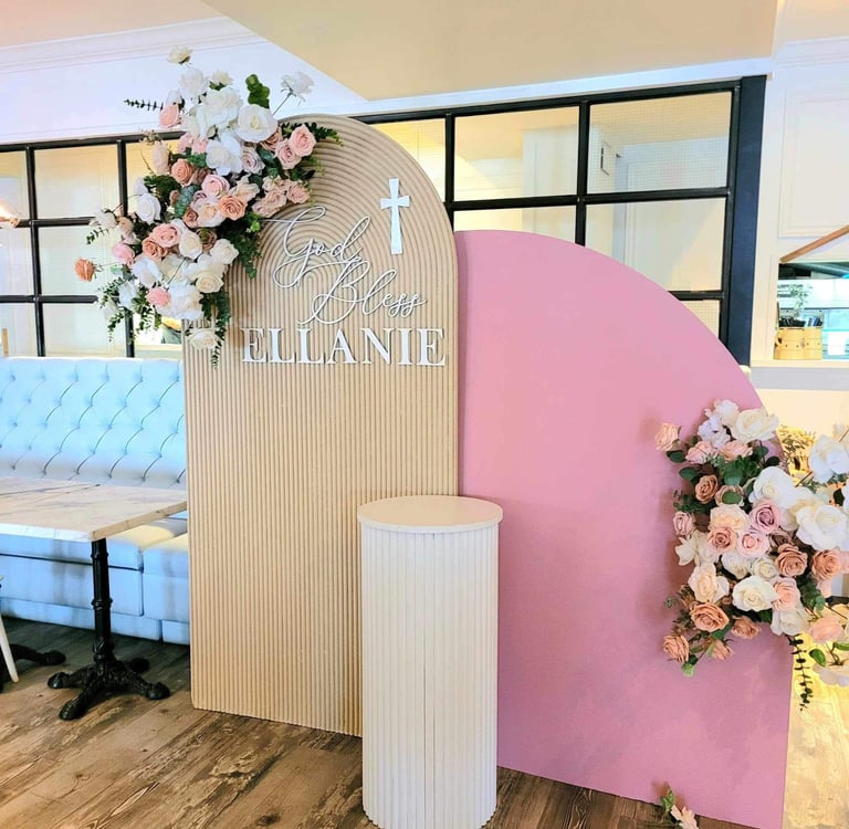 Baptism backdrop in pink and beige at Nodo Restaurant on St Clair