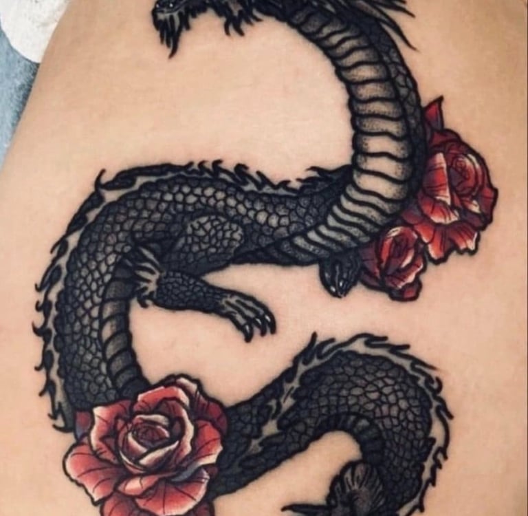Detailed black ink Japanese dragon tattoo with vibrant red roses on skin.