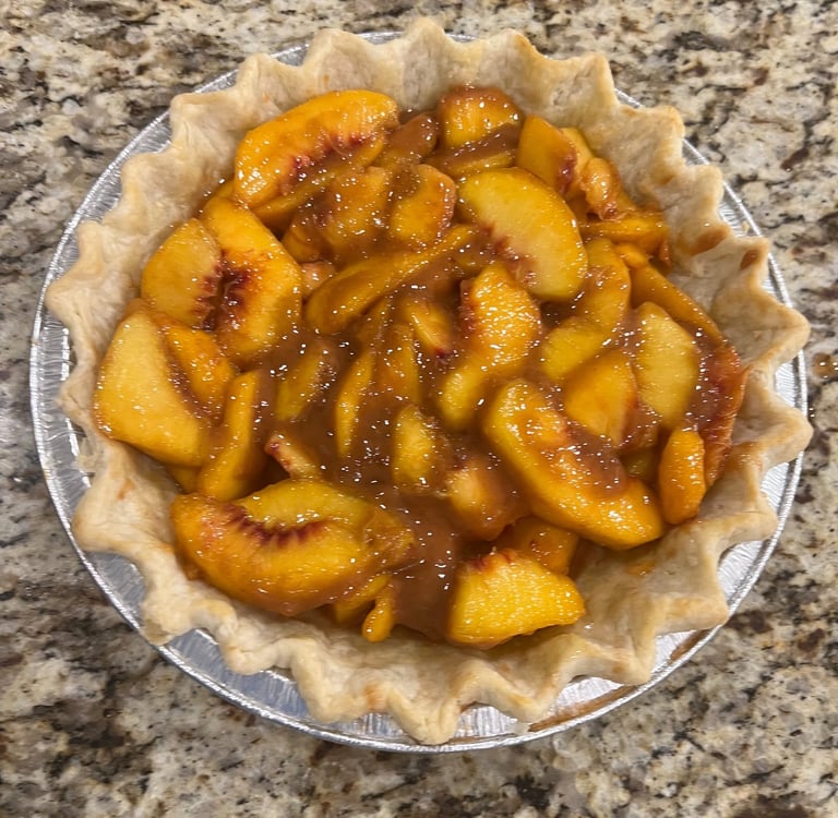 layer of peaches and bourbon reduction