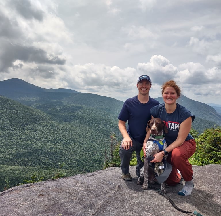 Logan Yerger and Suzanne Colesar Yerger on a hike with their dog