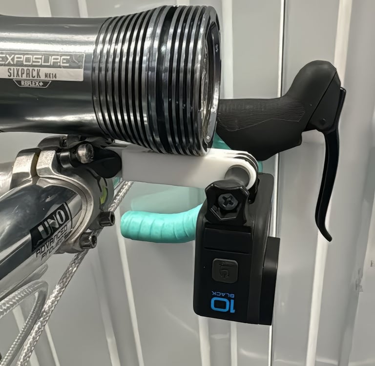 combo mount on a green bike with exposure light and Gopro camera installed