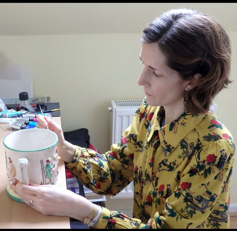 Mandy conserving a ceramic frog surprise mug