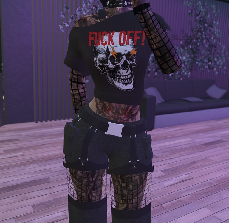 a top with a skull that says fuck off in red.