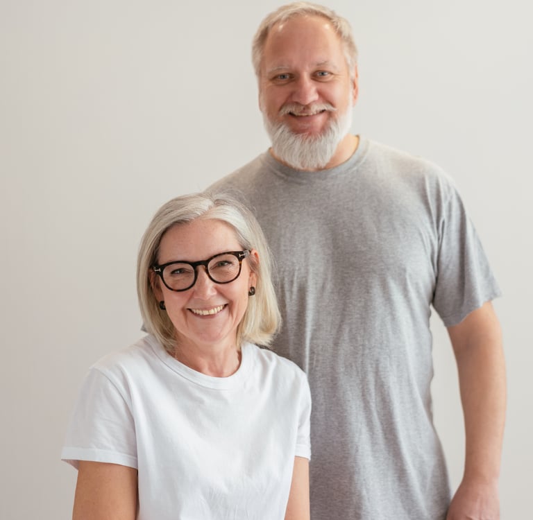 a smiling, middle-aged caucasian couple