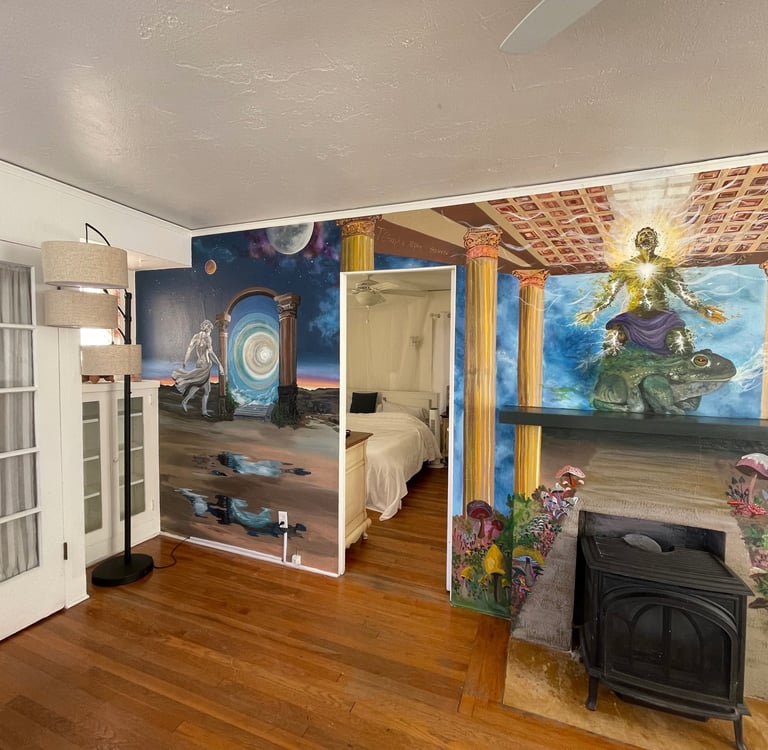 the living room, complete with a fireplace and vibrant wall art