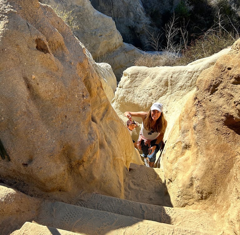 the author's mother climbing the staircase at the end of Annie's Canyon Trail. 