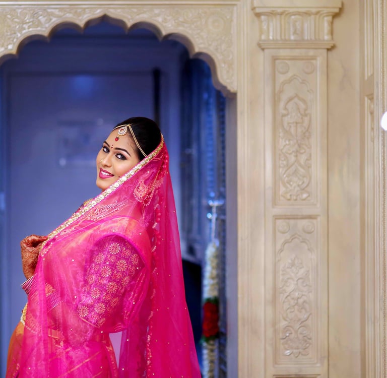 a woman in a pink sari, wedding photography
