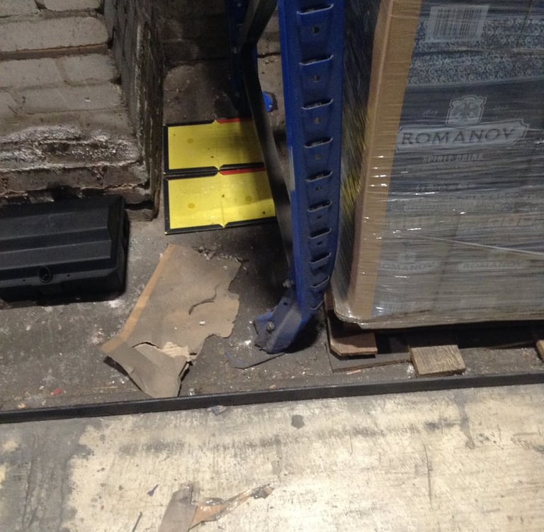 Damaged pallet racking upright requiring racking inspection