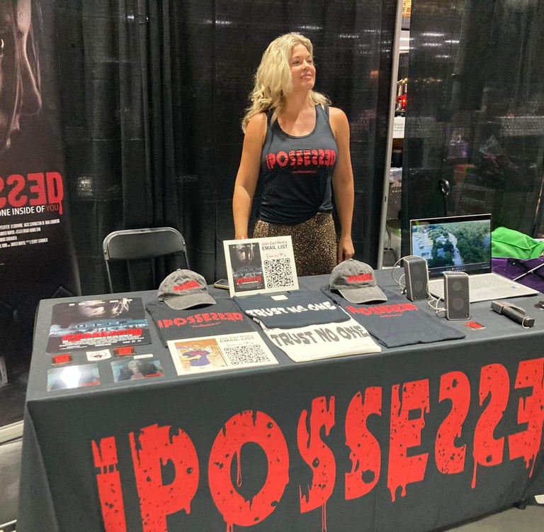 a woman standing in front of a table with a sign that says possy