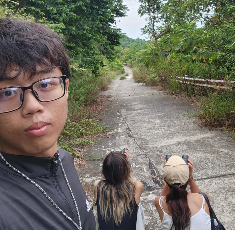 Da Nang tour guide and tourists watching langurs on Son Tra mountain.