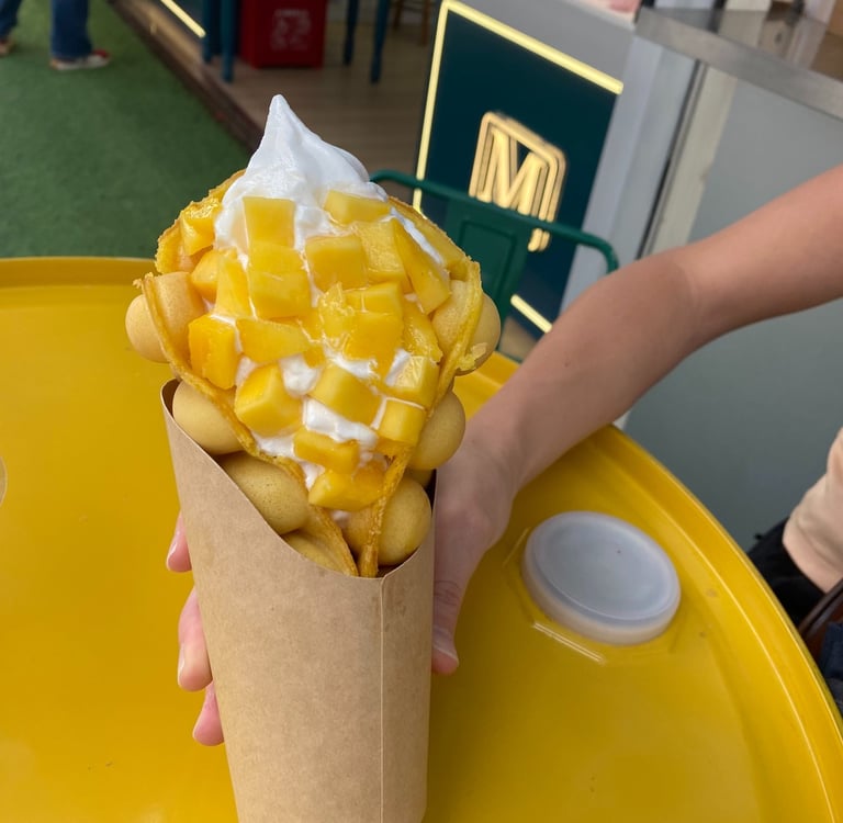 bubble waffle in shnaghai filled with mango and ice cream