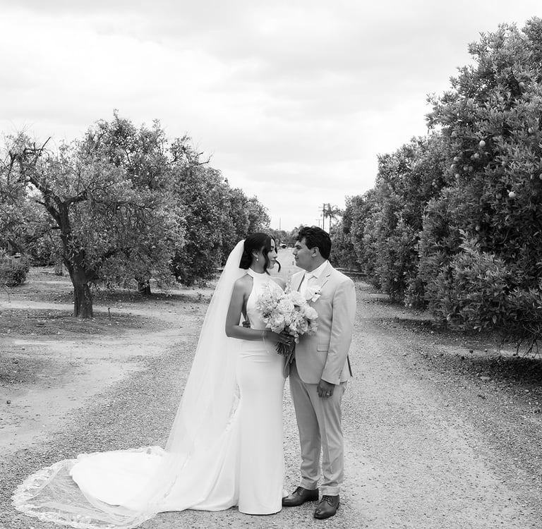 a bride and groom kissing at The Grove Redlands