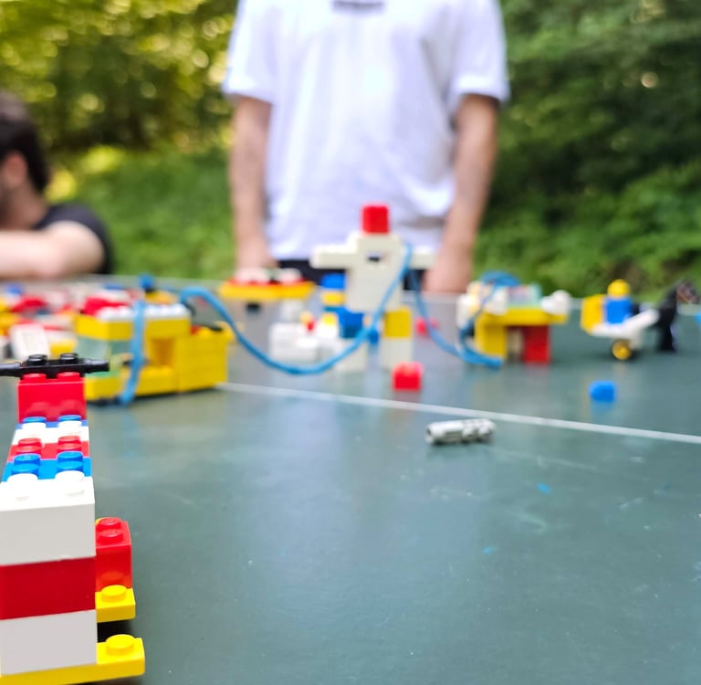 a group of people playing with legos