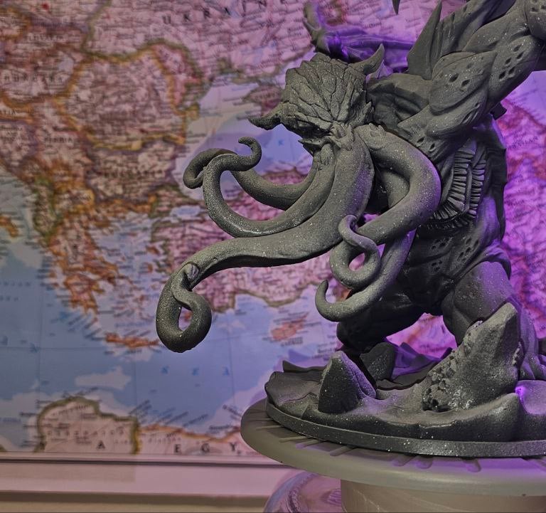 a statue of a dragon with a dragon on it