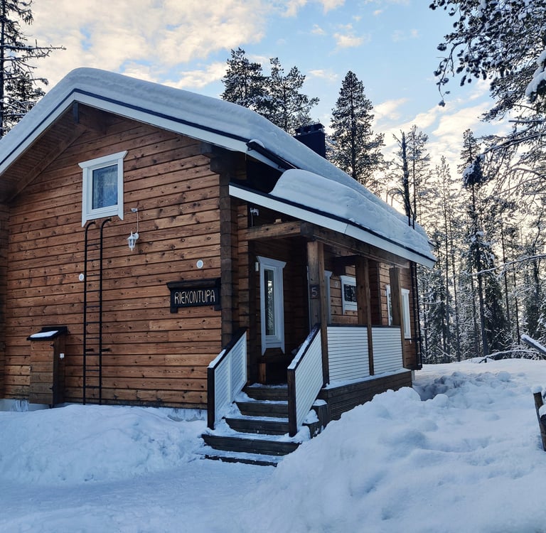 Rustic finnish log cabin in a snowy winter landscape, riekontupa cabin located in Kittilä lapland